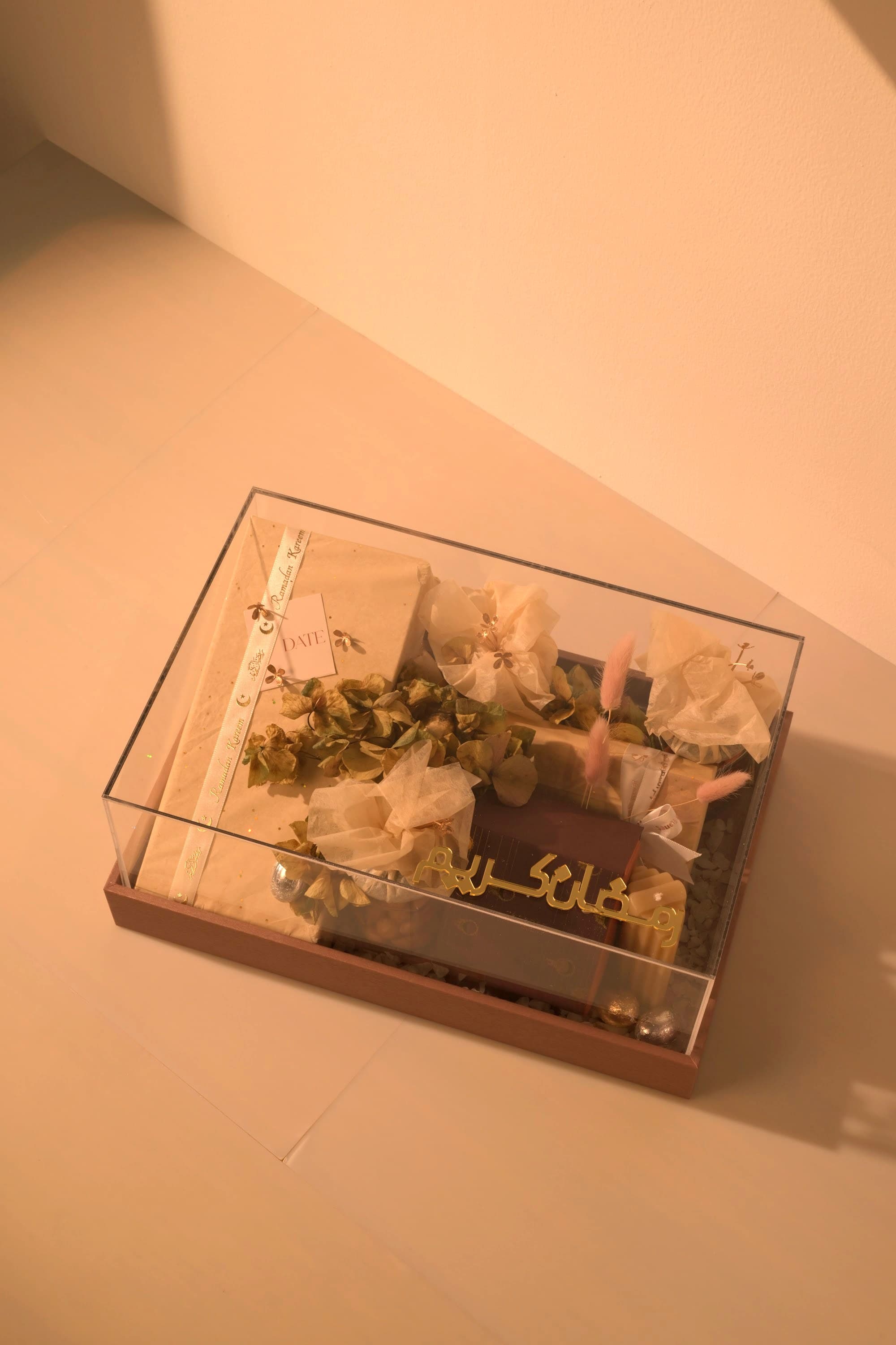 A polished Bare & Brown corporate gift box with premium chocolates, dates and florals