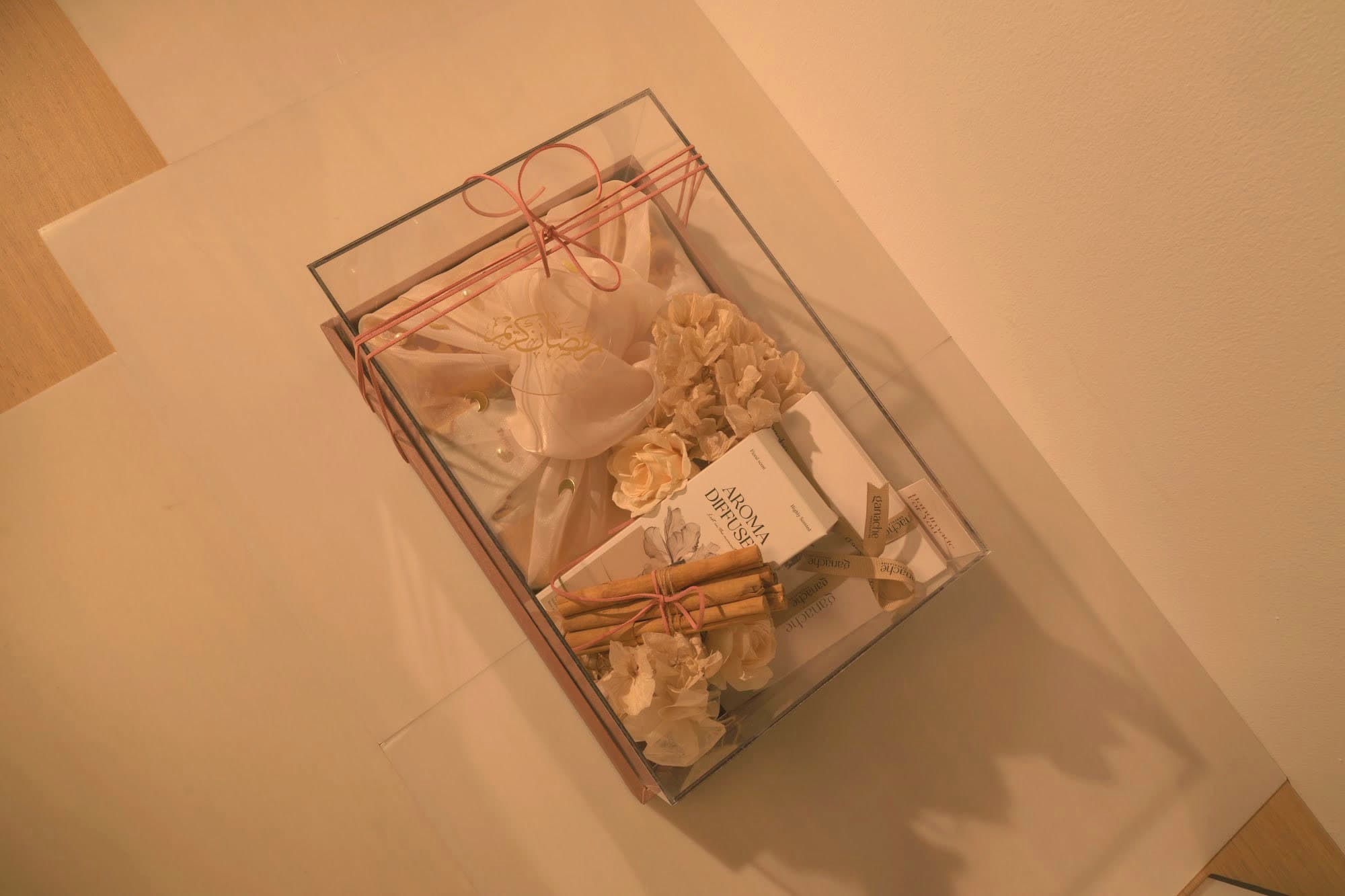 An elegant Bare & Brown gift box with a diffuser, florals and cinnamon, for Abu Dhabi clients
